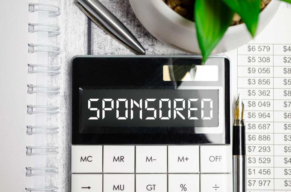 word sponsored table calculator finance concept