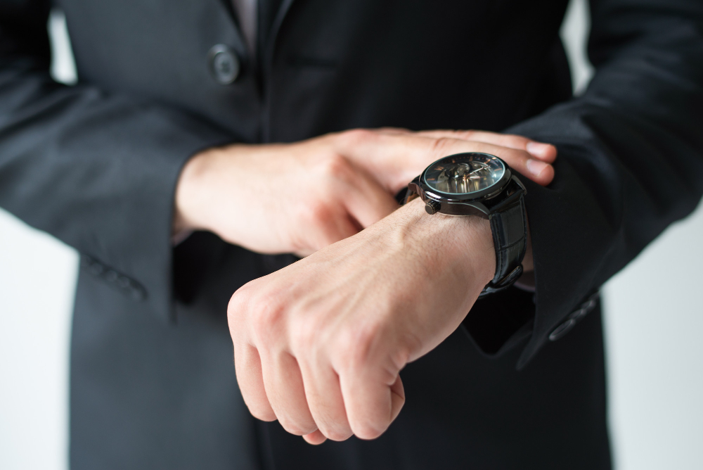businessman consulting wristwatch
