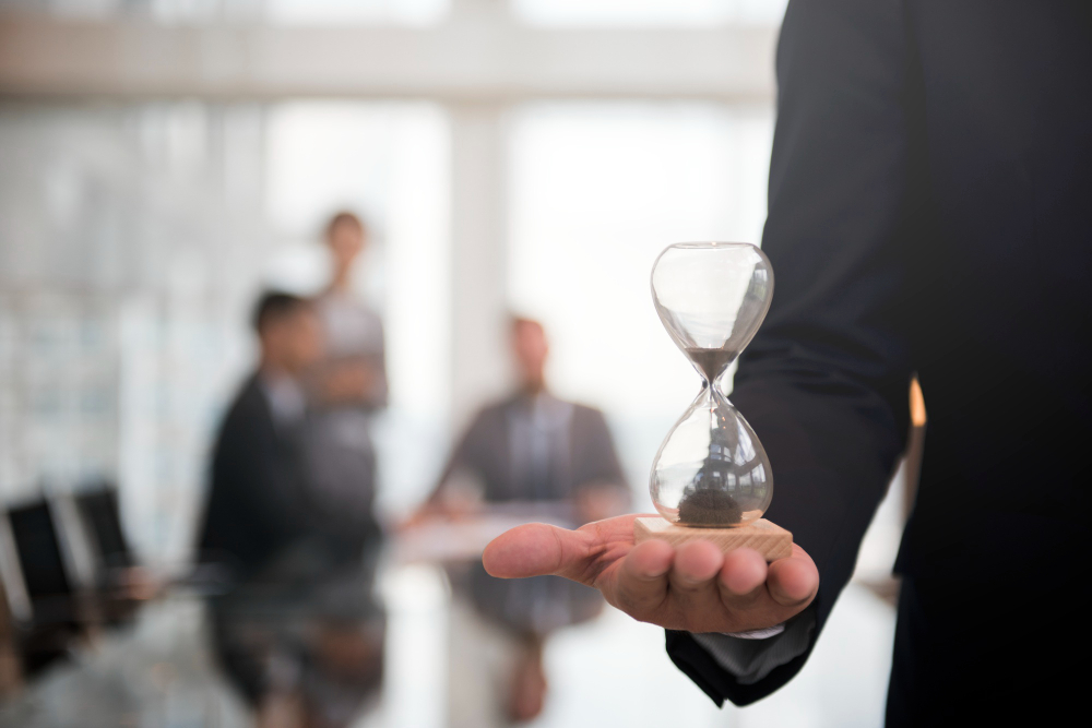 businessman holding hour glass signifies importance being time 1